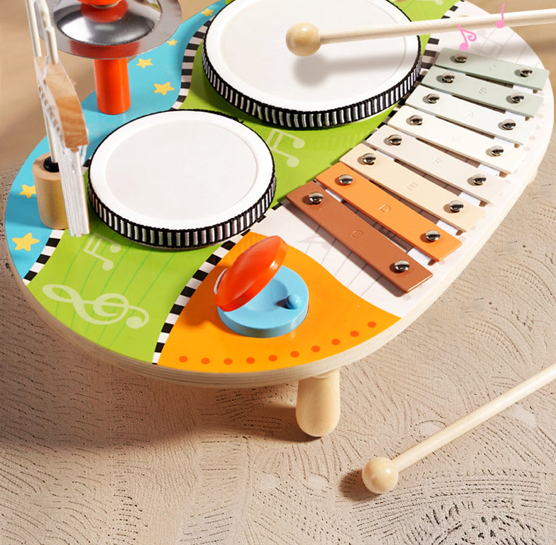 Set de percusión infantil 5‑en‑1 con instrumentos de madera eco‑friendly, 2 tambores, metalófono de 8 notas, platillo, güiro, carillón y 2 baquetas